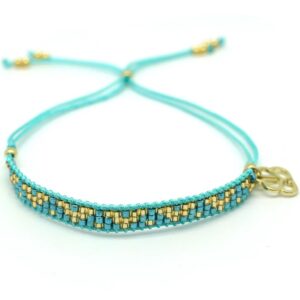 A friendship-style bracelet with three rows of hand-threaded turquoise Japanese Miyuki beads on a turquoise cord, with gold and turquoise beads and our gold signature logo charm. Fastens using a Chinese knot pull-through, making it suitable for most wrists. Boho Betty jewellery comes beautifully packaged – the perfect gift for someone special or for treating yourself! Bracelet length adjustable up to 26cm. Made with 12k gold on brass.