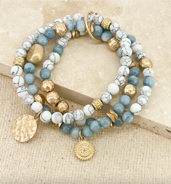 Gold layered stretch bracelet with white and blue beads