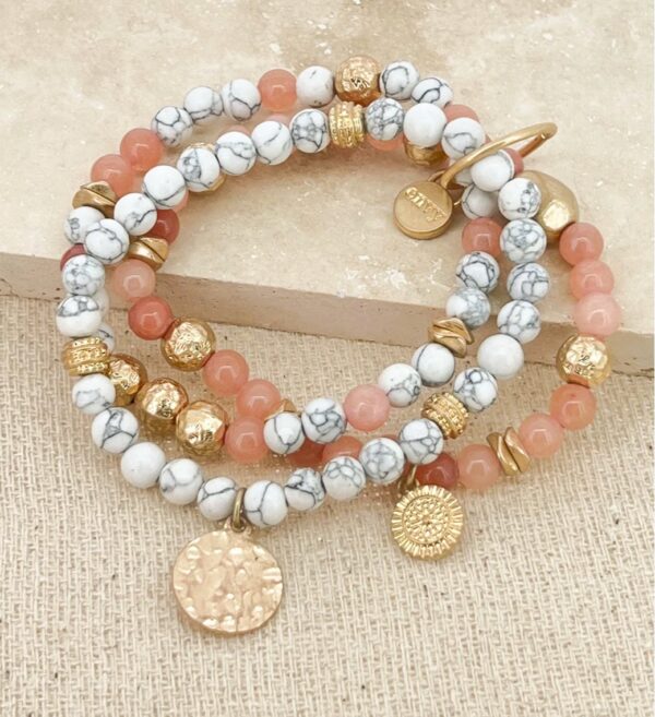 Gold layered stretch bracelet with white and pink beads