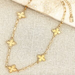 Short gold necklace with yellow flower detail