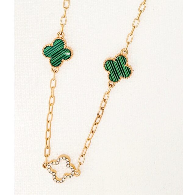 Long gold necklace with diamante and green fleurs