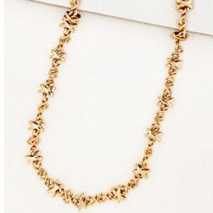 Short gold cross design necklace