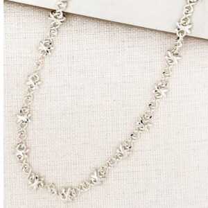 Short silver cross design necklace