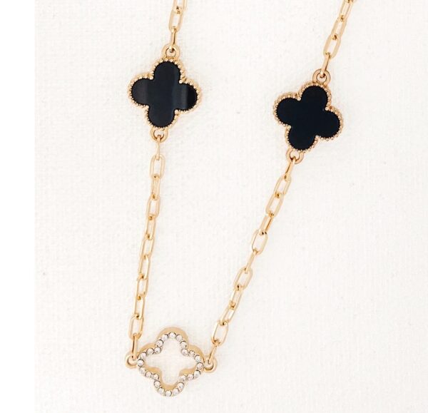 Long gold necklace with diamante and black fleurs